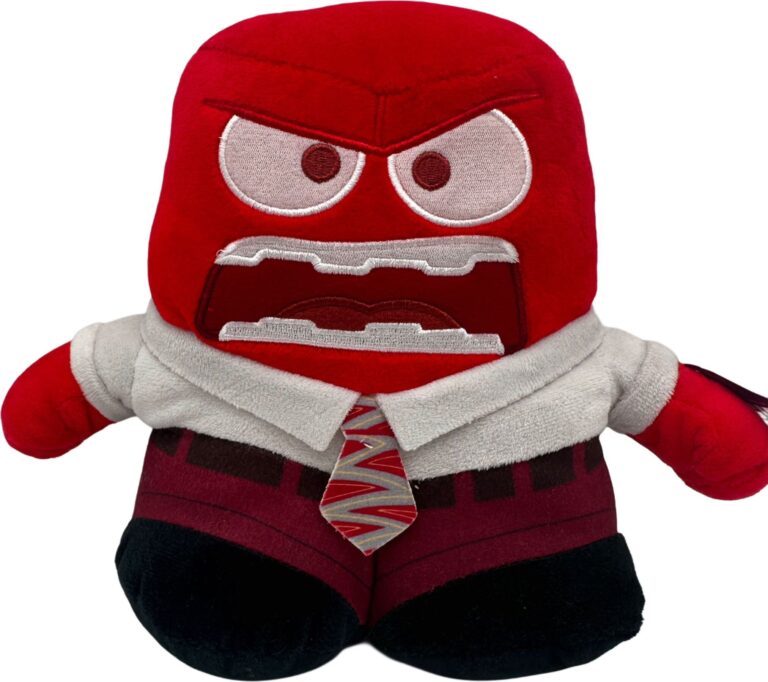 Rotes Stofftier in Anzug mit lustiger Krawatte und ausdrucksstarken Gesichtszügen. Rotes Stofftier in Anzug mit lustiger Krawatte und ausdrucksstarken Gesichtszügen.