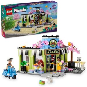 LEGO Café-Spielset mit Figuren, Roller und Box im Hintergrund.